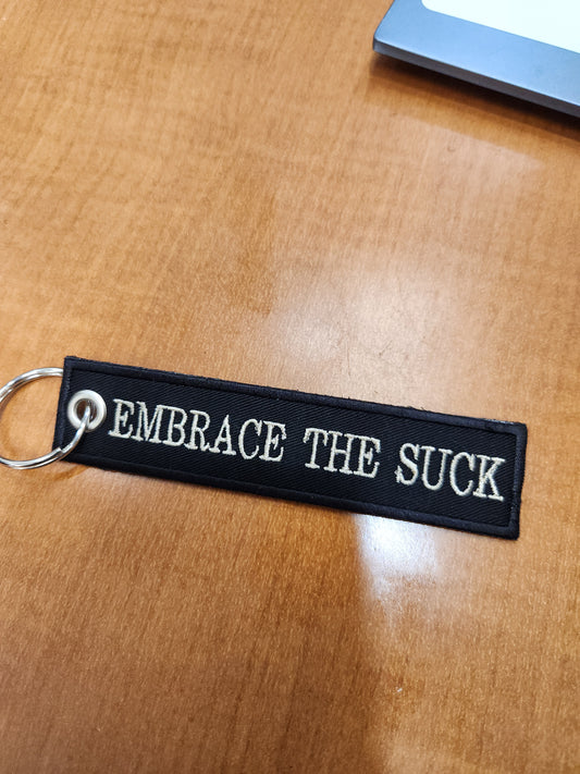 Embrace the suck strip keychain